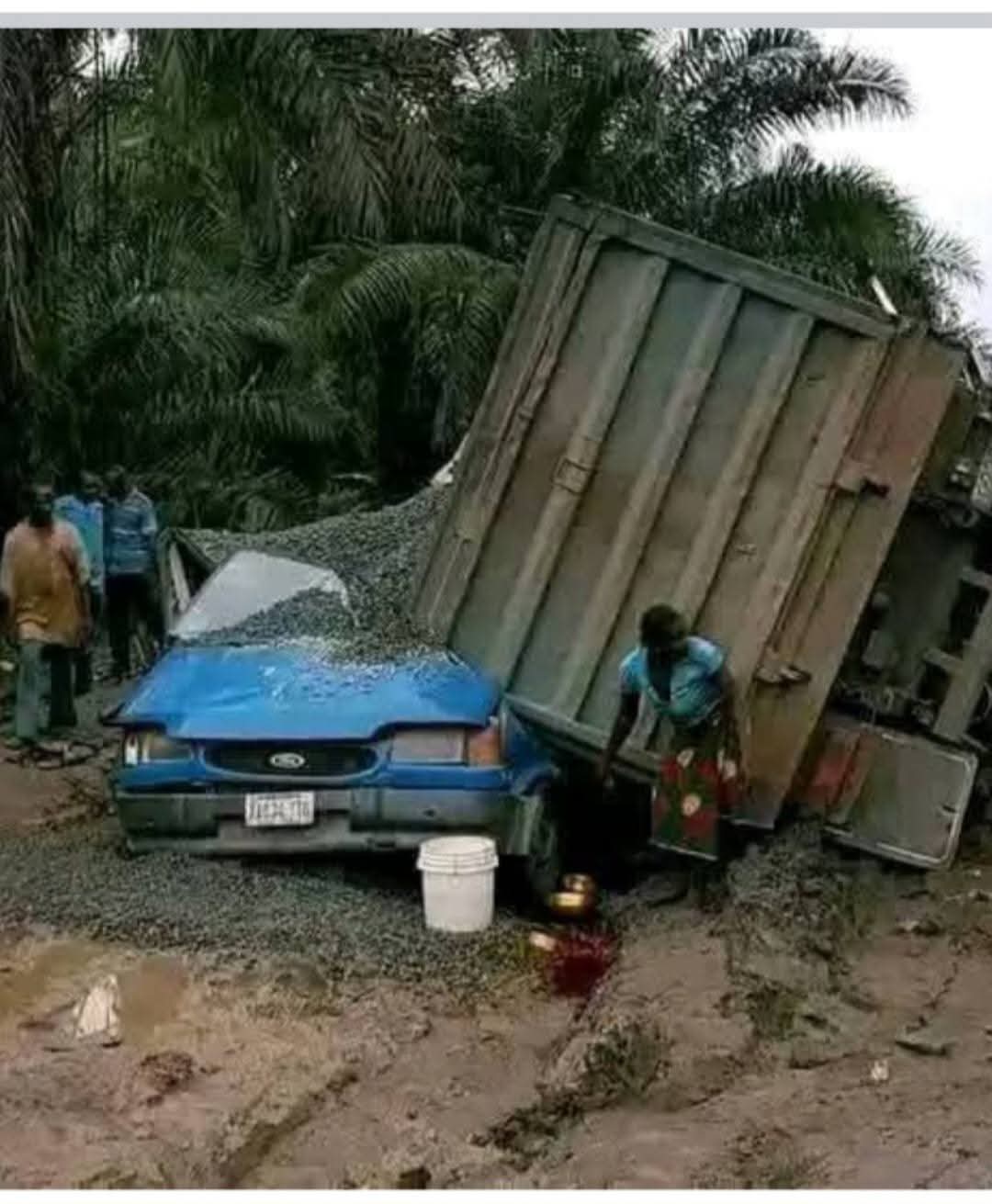 Breaking: Forty Foot Container falls on Commute Bus, Lives Endangered